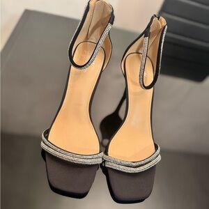 Sleek Black Heels with Ankle Strap and Modern Design